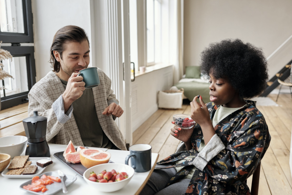 man and woman having breakfast