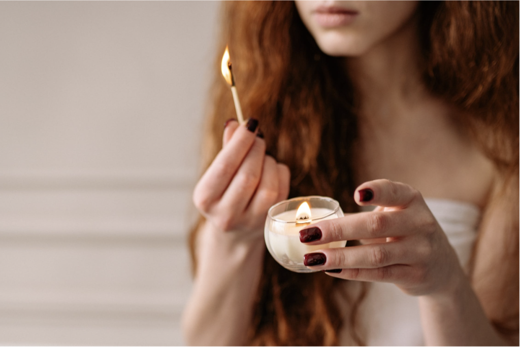 woman lighting candle