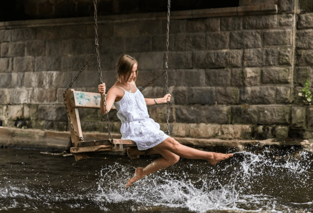 woman playing on a water swing