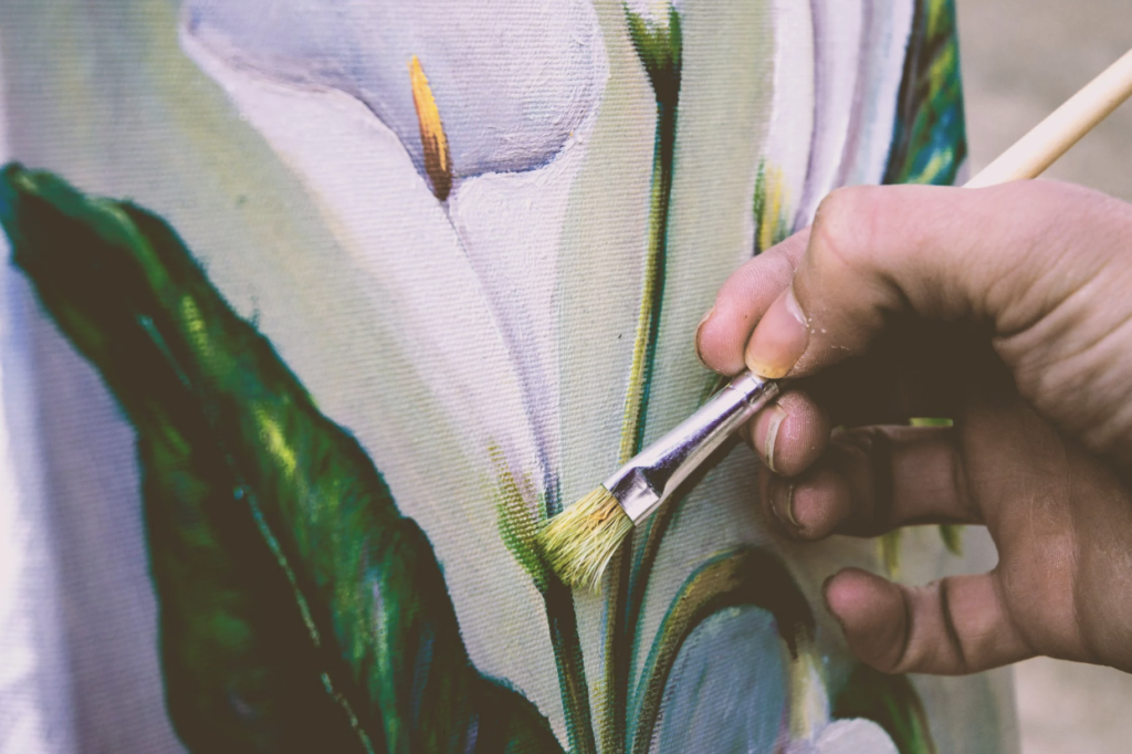 hand painting a flower