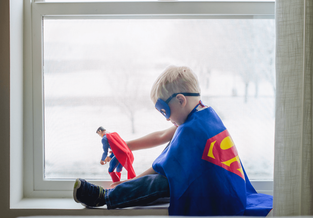 kid wearing a superman costume