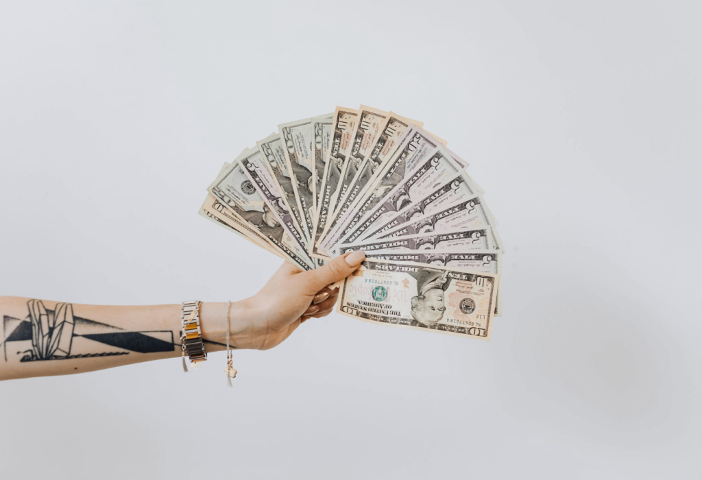woman's hand holding cash