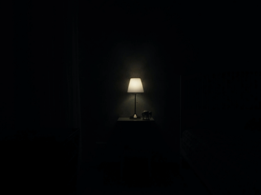 a lit up lamp in a dark room